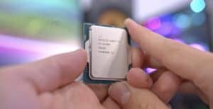 Man_Holding_CPU_Intel_Core_i3.jpg