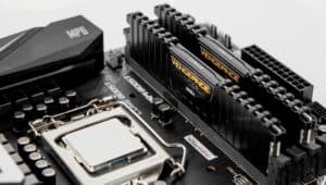 Two_Black_Corsair_Vengeance_RAM_Sticks_on_Motherboard.jpg